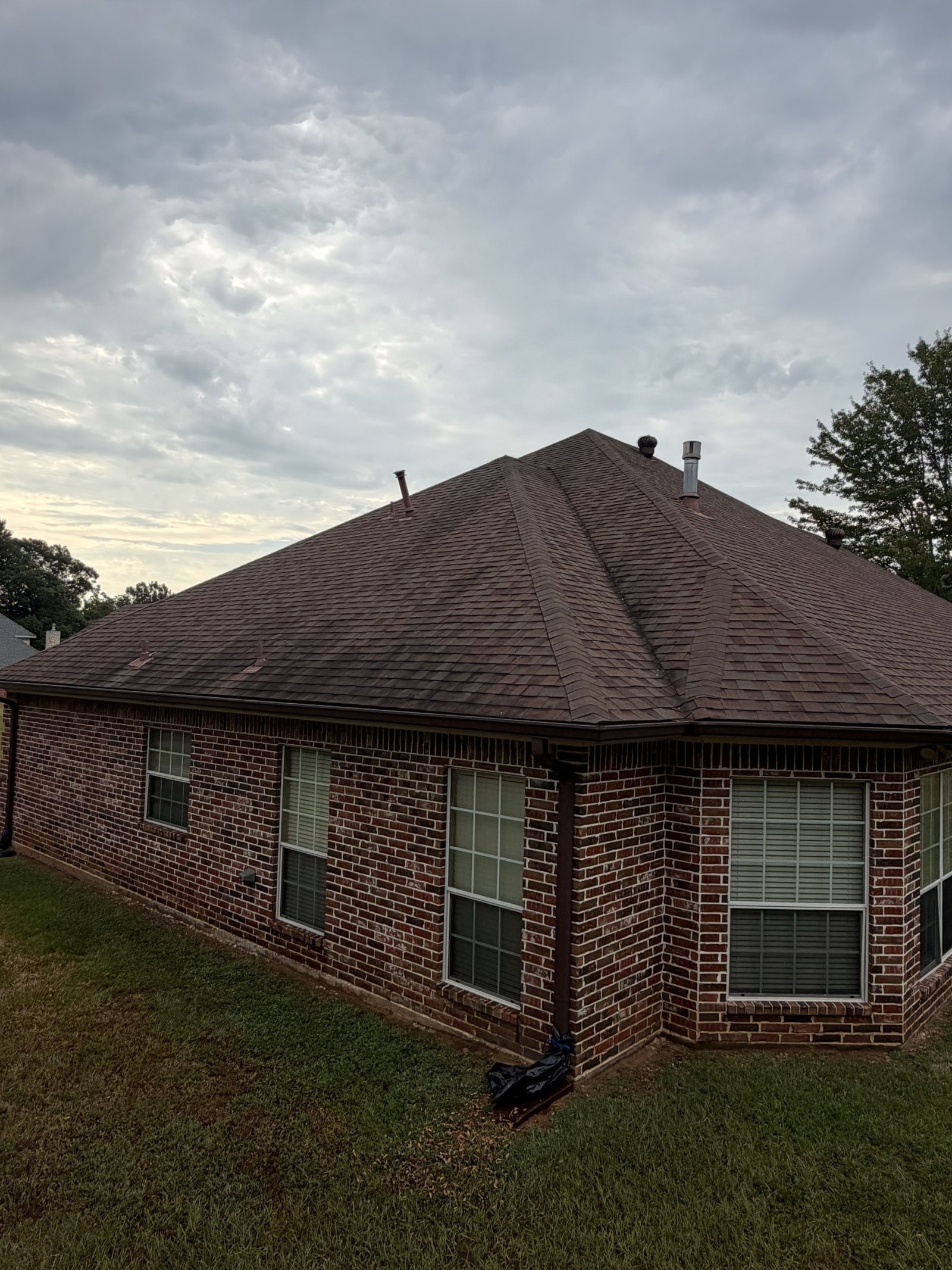 Brick home roof before cleaning