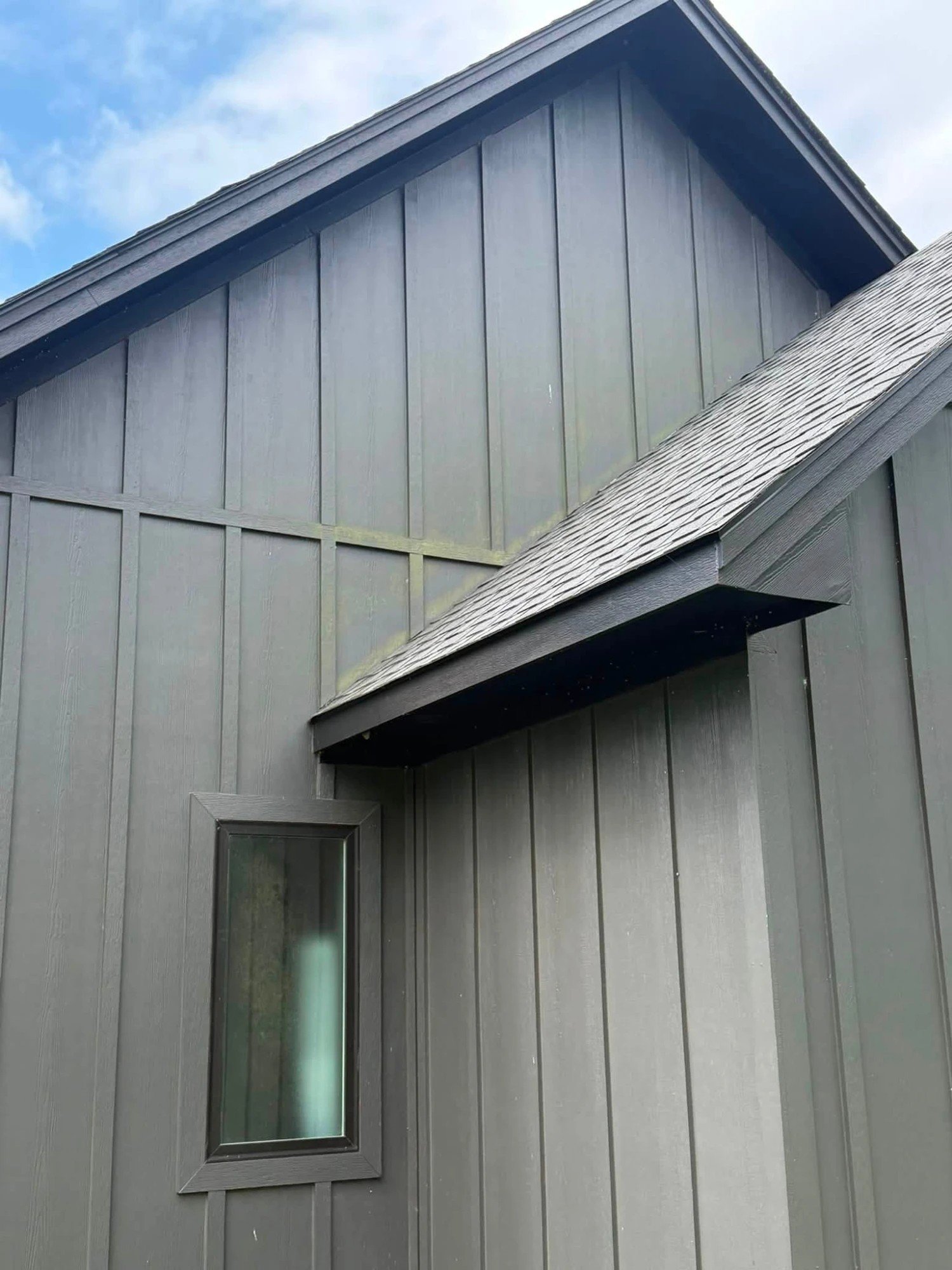 Board-and-batten siding before cleaning